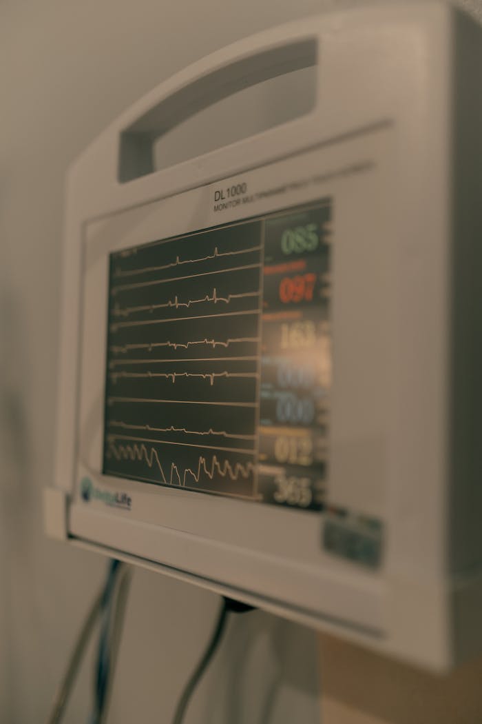 The Art of Drawing Readers In: Your attractive post title goes here A detailed view of a hospital heart rate monitor displaying vital signs and heart rate patterns.